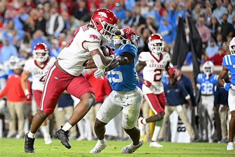 No. 16 Mississippi scores 10 points in fourth quarter to rally for 27-20 win over Arkansas